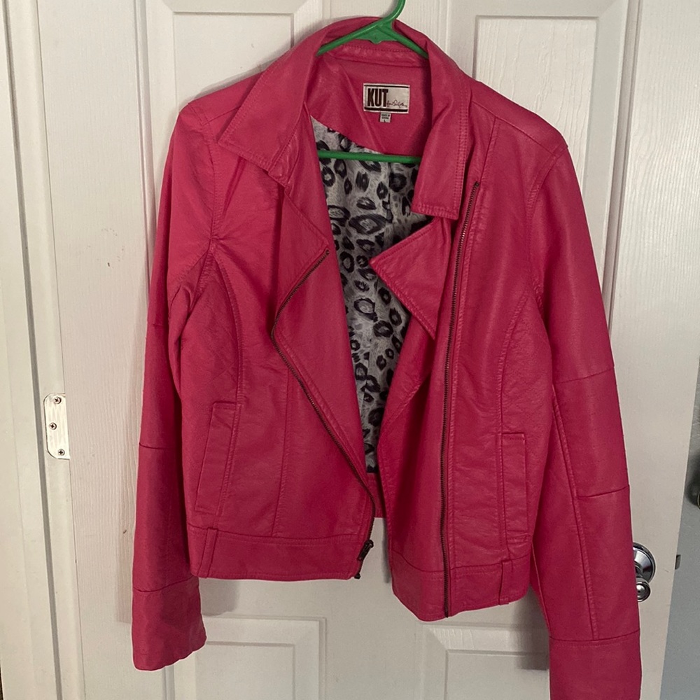Hot pink faux leather motorcycle jacket.